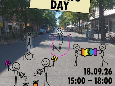 Bahnhofstraße mit gezeichneten Blumen und spielenden Kindern. Die Schilder sagen „Parking Day“ und „Stadt für alle statt für Autos“.   