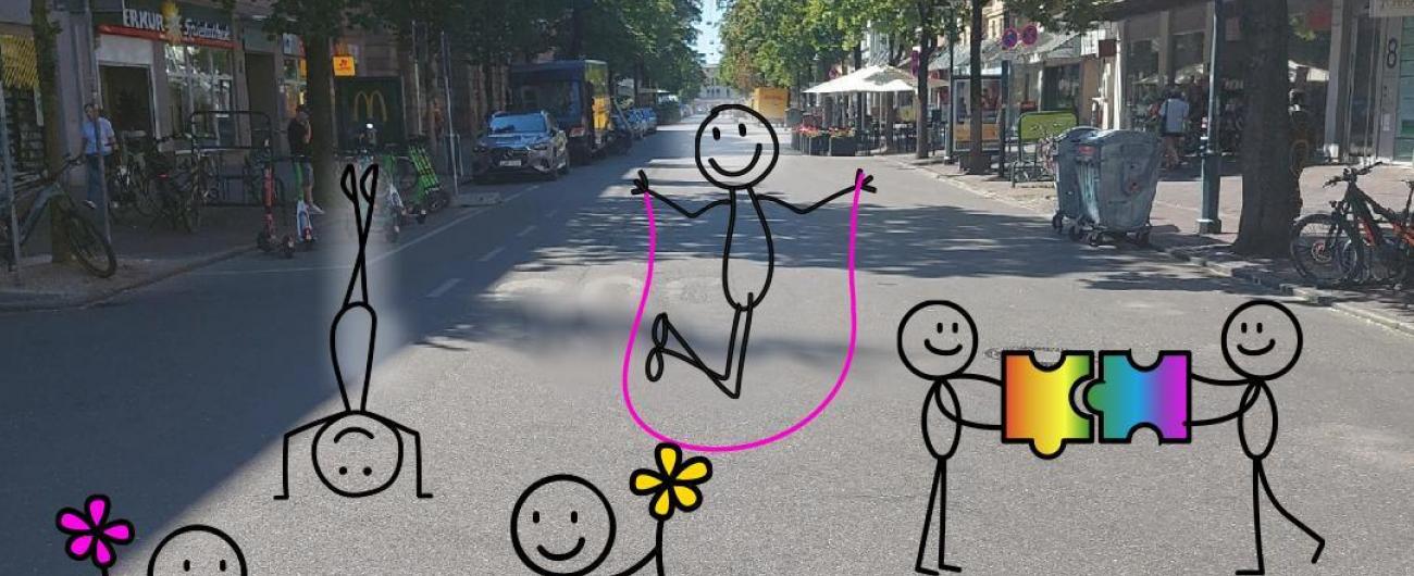 Bahnhofstraße mit gezeichneten Blumen und spielenden Kindern. Die Schilder sagen „Parking Day“ und „Stadt für alle statt für Autos“.   